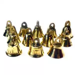 Close-up of small brass altar bells from a set of twelve, showing loop tops for stringing and smooth domed brass construction