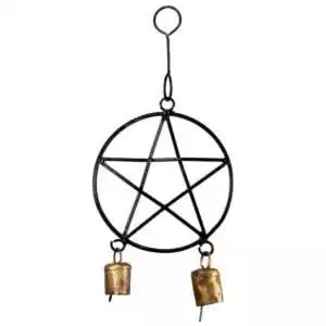 Black wrought iron pentagram hanging decoration with two small copper bells attached at the bottom, for threshold protection and Wiccan decor.