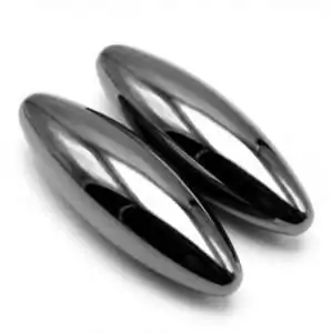 Two shiny elongated black magnetic hematite oval stones with smooth reflective surfaces — polished pair for grounding and energy work.