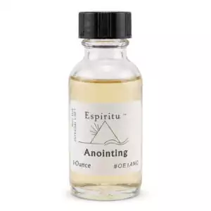 A clear glass bottle of anointing oil with a black cap labeled Espiritu Anointing — a 1oz general-purpose ritual fragrance for blessing, consecration, and pre-ceremony candle anointing.
