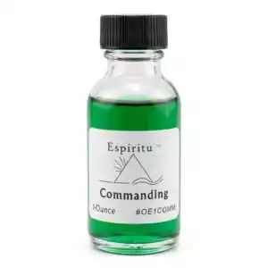1oz glass bottle of Espiritu Commanding ritual anointing oil with label, a classic hoodoo authority formula for projecting influence.