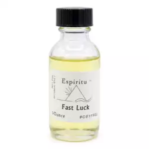A small glass bottle containing yellow liquid labeled Fast Luck by Espiritu — a 1oz classic hoodoo gambling formula for rapid luck drawing and fortunate outcomes in ritual work.