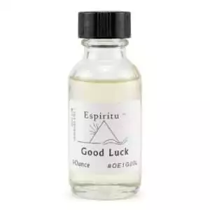 1oz glass bottle of Espiritu Good Luck ritual oil with label, a classic fortune and prosperity drawing formula.