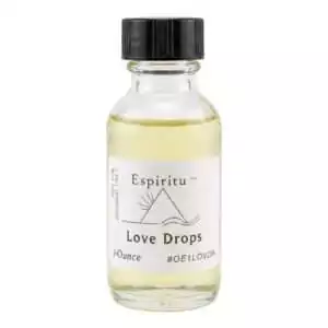 1oz glass bottle of Espiritu Love Drops ritual aroma oil with label, a sweet affection-drawing formula for tender love and relationship sweetening.