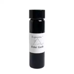 Small 2 dram glass vial of Espiritu Elder Gods ritual oil with label, for invoking primordial and cosmic deity archetypes in ceremonial magic.