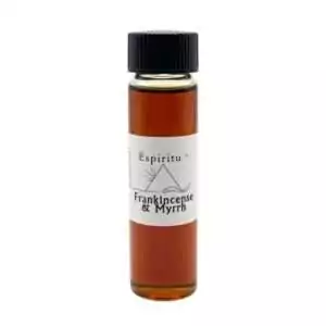 Small 2 dram glass vial of Espiritu Frankincense and Myrrh ritual oil with label, a timeless sacred resin blend for purification and consecration.