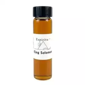 Small 2 dram glass vial of Espiritu King Solomon ritual oil with label, for Solomonic magic, wisdom invocations, and ceremonial authority workings.