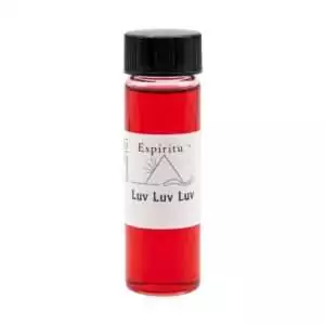 Small 2 dram glass vial of Espiritu Luv Luv Luv ritual oil with label, a sweet triple love-drawing fragrance oil for romance rituals.