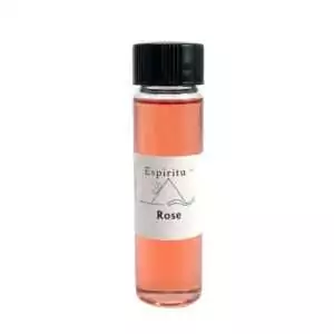 A small glass vial containing pink liquid labeled Espiritu Rose — a 2-dram ritual fragrance oil for love spells, Venus workings, and self-love anointing rituals.