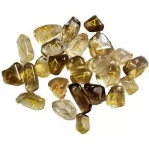 Set of 25 citrine Elder Futhark rune stones in golden yellow, each engraved with a Norse rune symbol for use in abundance and divination workings.
