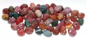 Fancy jasper tumbled stones 1 lb bulk — smooth polished multicolor earthy jasper pieces in varied greens, purples, and creams for grounding crystal work.