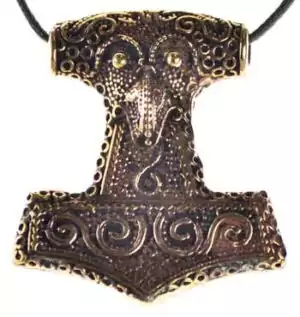 Heavy bronze Mjöllnir pendant with intricate carved raven head and Nordic knotwork detail, suspended on black cord against white background