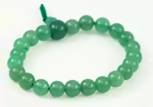 Aventurine power bracelet of small round green polished stone spheres on a cord with a knotted closure, displayed on white background