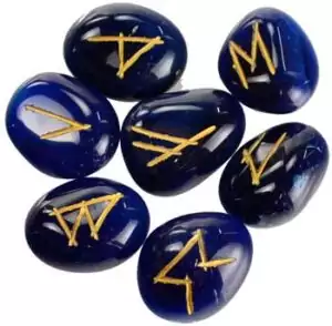 Blue onyx rune set 25 pieces with Elder Futhark engravings — natural deep blue gemstone tiles showing carved Norse rune alphabet for throat chakra crystal divination.