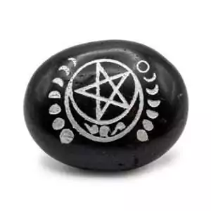 Tourmaline palm stone carved with pentagram and moon symbols for Wiccan protection and grounding