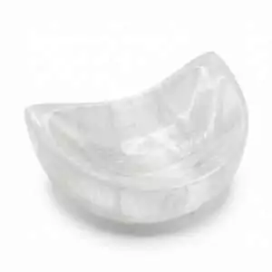 4-inch selenite half moon crescent bowl with a smooth polished surface — a crystal cleansing and charging dish for placing stones overnight on an altar.