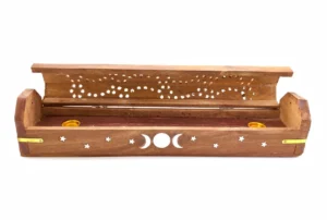 Flip-top carved wooden incense holder featuring triple moon phase cut-out designs on the front panel, with compartments for incense sticks and cones.
