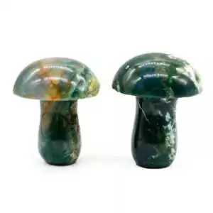 Moss agate crystal mushroom carving set with translucent green and white forest inclusions for growth, spiritual awakening, and botanical altar decor display.