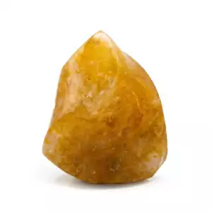 Hematoid quartz yellow flame carving with golden and orange iron-included quartz in dramatic flame shape for solar energy, grounding transformation, and altar display.