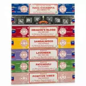 Satya incense variety pack showing a stack of 7 incense boxes including Nag Champa, Dragon's Blood, and other hand-rolled scents — 105 sticks total.
