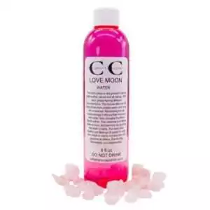 8oz bottle of Love moon water β ritual-charged water for love spells and heart chakra intention work.