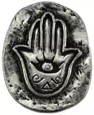 Silver metal Hamsa pocket stone amulet featuring a hand shape with eye at center and decorative lower elements — traditional protection and evil eye warding talisman.