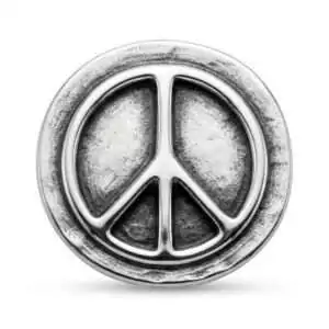 Round silver peace symbol pocket stone talisman with textured surface carried as a daily grounding object for calm and mental clarity