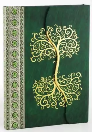 Celtic tree embossed leather blank journal showing detailed tree of life cover design on rich leather, blank ritual writing book for Book of Shadows and grimoire use