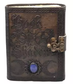 Leather-bound Book of Shadows journal with embossed triple moon design, embedded blue stone, and metal latch closure.