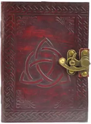 Triquetra embossed leather blank journal with metal latch closure showing Celtic trinity knot design on cover, ritual writing book for Book of Shadows and grimoire