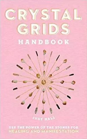 Crystal Grids Handbook by Judy Hall hardcover showing the title with crystal grid imagery — a Fair Winds Press guide to sacred geometry and crystal arrangement layouts.