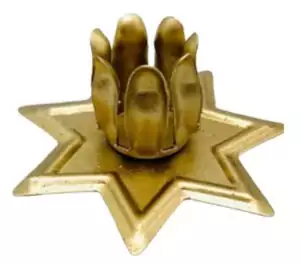 Star-shaped celestial candle holder for taper and chime candles, a household ritual accessory evoking cosmic guidance and altar-ready celestial aesthetics.