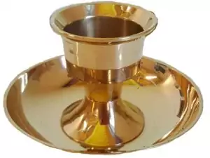 Antique brass dual-purpose candle holder designed to fit both taper and pillar candles for versatile altar setups and ritual candle work