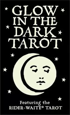 Glow in the Dark Tarot box cover featuring bold white text on black with a stylized moon and face design and scattered stars.