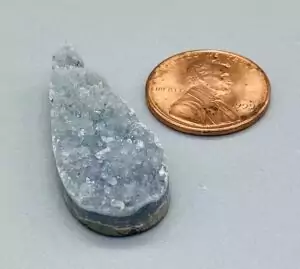 A 1.5-inch amethyst teardrop druzy cabochon with sparkling purple crystal druse surface and flat back, suitable for wire-wrap pendant jewelry.