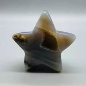 Polished star agate specimens weighing 1 to 1.5 pounds, showing distinctive natural star-pattern radiating inclusions within translucent agate stone.
