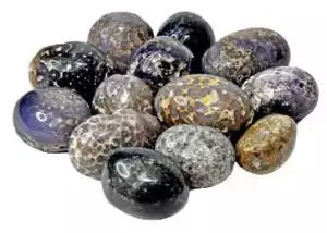 One pound bulk lot of tumbled grape agate stones showing purple botryoidal cluster formations in lavender and deep violet shades, rare Indonesian collector crystals.