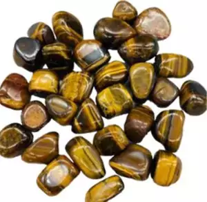 One-pound collection of smooth golden brown yellow tiger's eye tumbled stones with chatoyancy for solar plexus confidence abundance and protection work