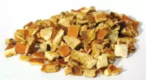 Dried orange peel Citrus sinensis cut pieces arranged in a pile showing the dried and chopped citrus peel texture