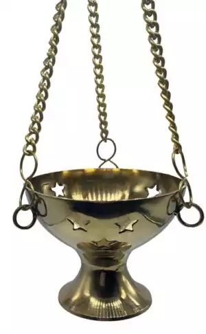 Polished brass hanging incense burner censer with chain suspension, designed for altar use burning cone or resin incense in a temple-style ritual setting.