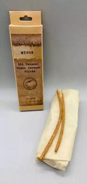 Natural myrrh incense sticks wrapped in beige paper showing 10-pack ritual incense for meditation and purification.