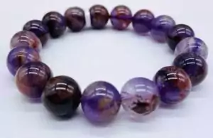 Super 7 Melody Stone bracelet with 12mm large multi-mineral crystal beads for full chakra activation, deep meditation, and advanced spiritual practice wear.