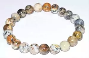 8mm dendritic opal bead bracelet on stretch cord showing white stone with dark tree-like mineral inclusion patterns