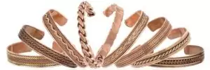Collection of copper magnetic bracelets in multiple styles — braided and patterned cuff designs arranged in an arc, all in warm copper tone.