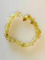 A stretch bloodstone chip bracelet showing natural dark green stone chips with distinctive red jasper spot inclusions, elastic beaded crystal healing jewelry.