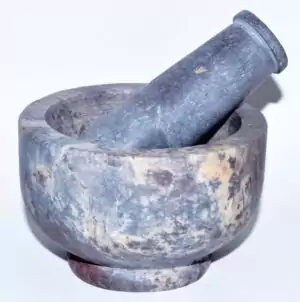 Soapstone mortar and pestle set 4 inch, smooth grey natural stone ritual herb grinding tool with curved bowl and matching pestle for ritual botanical preparation.