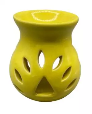 Yellow ceramic tealight oil diffuser 4 inch tall for essential oils and aromatherapy on altar