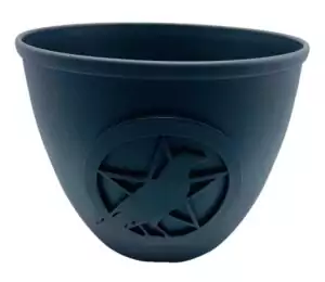 Cast iron 3.5 inch candle holder with pentagram and bird design, a durable Wiccan altar accessory for taper and chime candles in ritual practice.
