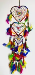 12-inch rainbow heart dreamcatcher with colorful rainbow-strung heart shape and dangling feathers for love protection and joyful bedroom or sacred space display.