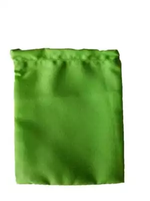Small 3x4 inch green cotton drawstring mojo bag used in hoodoo tradition for building money-drawing charm bags and prosperity workings.